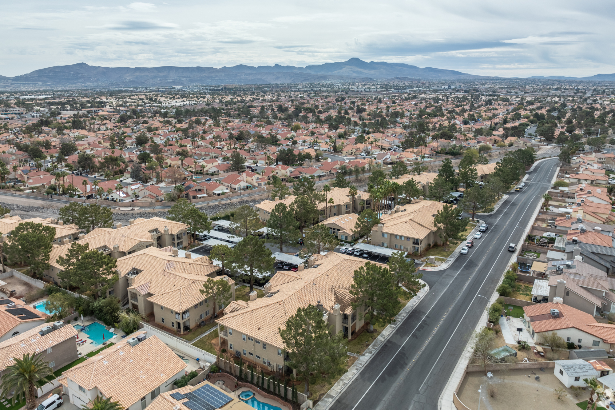Pines Apartments community pool, lounge area, and grill, Exterior